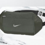 Nike Challenger Waist Pack in Olive Color on the Table