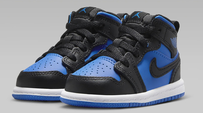 Nike Jordan 1 Mid Toddler Shoes on a Gray Background
