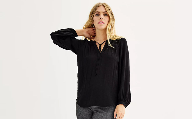 A Person Wearing Black Nine West Womens V Neck Trapunto Tunic