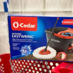 O Cedar Easywring Spin Mop on Top of a Shopping Cart