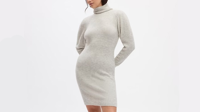 Person Wearing GAP Ribbed Puff Sleeve Sweater Mini Dress Person Wearing GAP Ribbed Puff Sleeve Sweater Mini Dress