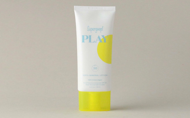 Supergoop PLAY 100 Mineral Lotion SPF 30 on a Gray Background