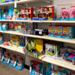 Tons of Fisher Price Toys on Shelves
