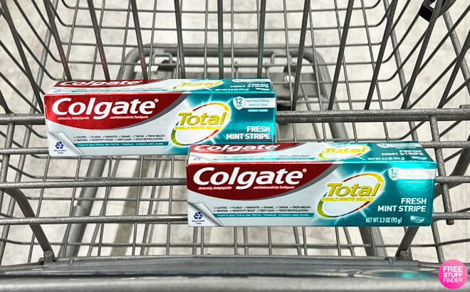 Two Boxes of Colgate Total Stripe Toothpaste Fresh Mint on a Cart