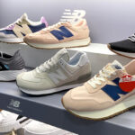 Various Styles of New Balance Sneakers on a Shelf