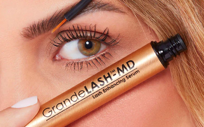 Woman is Holding Grande Cosmetics Lash Serum