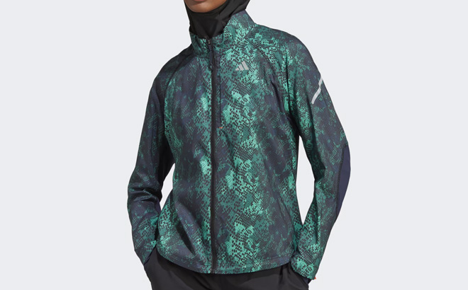Woman is Wearing Adidas Womens Fast Running Iteration Jacket in Collegiate Green Color Woman is Wearing Adidas Womens Fast Running Iteration Jacket in Collegiate Green Color