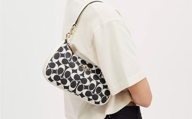 Woman is Wearing Coach Teri Shoulder Bag In Signature Canvas