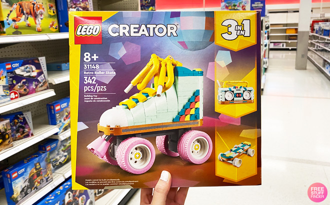 a Person Holding LEGO Creator Retro Roller Skate Building Set a Person Holding LEGO Creator Retro Roller Skate Building Set