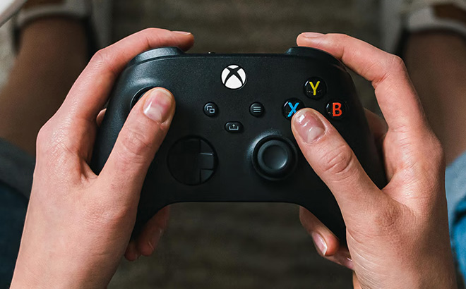 a Person Holding Microsoft Xbox 9th Generation Wireless Controller