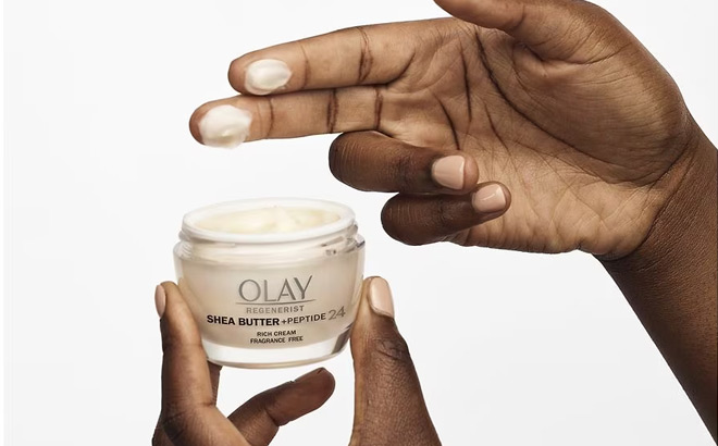 a Person Holding Olay Shea Butter Peptide 24 Face Moisturizer