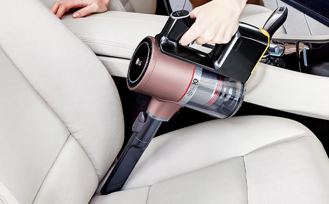 a Person Using LG Cordless Stick Vacuum