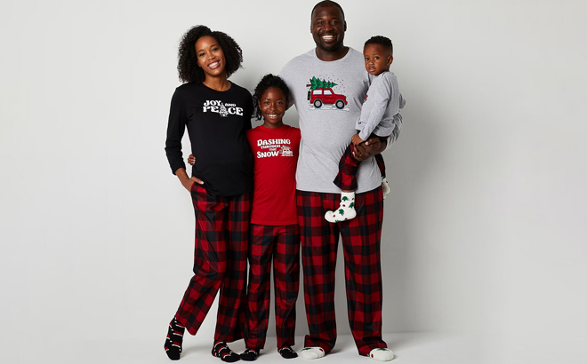an Image of a Family Wearing a Checks Trucks Buffalo Matching Family Pajamas