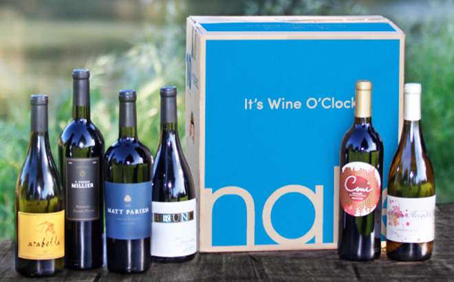 Naked Wines Box Next to Bottles of Wine on a Tabletop Naked Wines Box Next to Bottles of Wine on a Tabletop