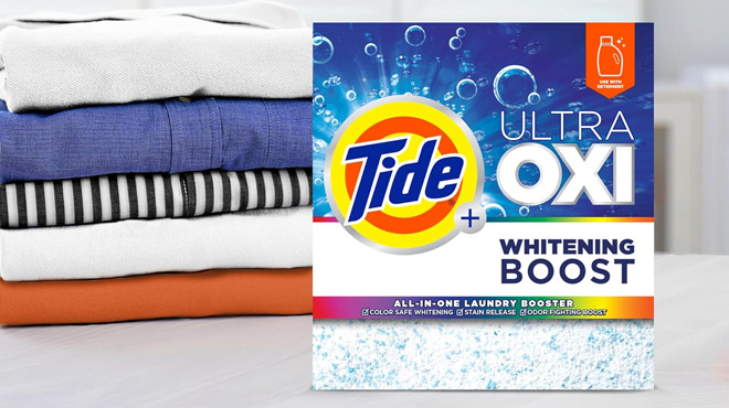 A Box of Tide Ultra Oxi Whitening Booster beside Folded Clothes