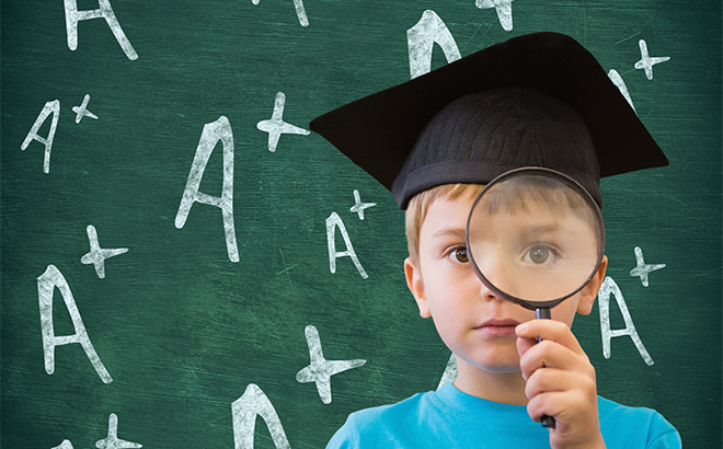 A Child Holding a Magnifying Glass with a School Board and Grade A Written on It to Prove he is Eligible for Rewards