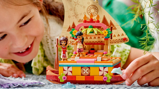 A Child Playing LEGO Disney Princess Moanas Building Toy Set