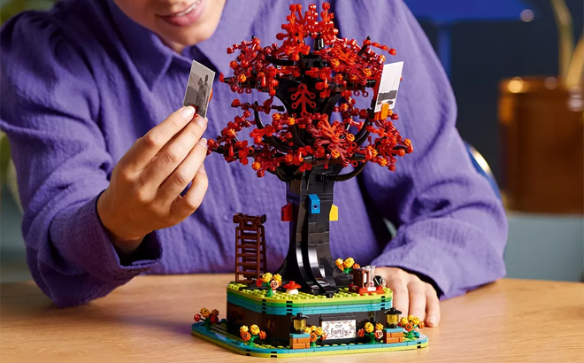 A Child Playing with the LEGO Ideas Family Tree Home Decor Building Set