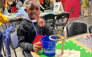 A Child in a Lowes Kids Workshop