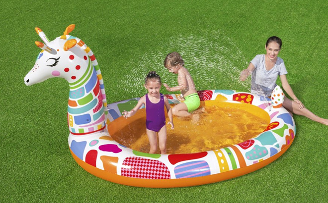 A Family Playing in the H2OGO Giraffe Inflatable Play Pool with Sprayer
