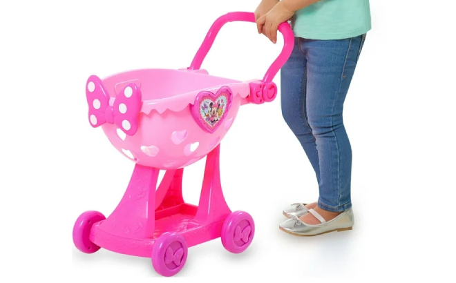 A Girl Holding Minnies Happy Helpers Bowtique Shopping Cart