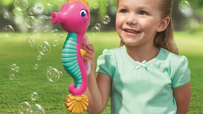 A Girl Holding a Play Day Seahorse Bubble Blower