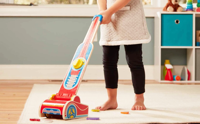 A Girl Playing with Melissa Doug Wooden Vacuum Cleaner