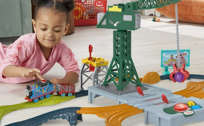 A Girl Playing with Thomas Friends Talking Cranky Delivery Train Set