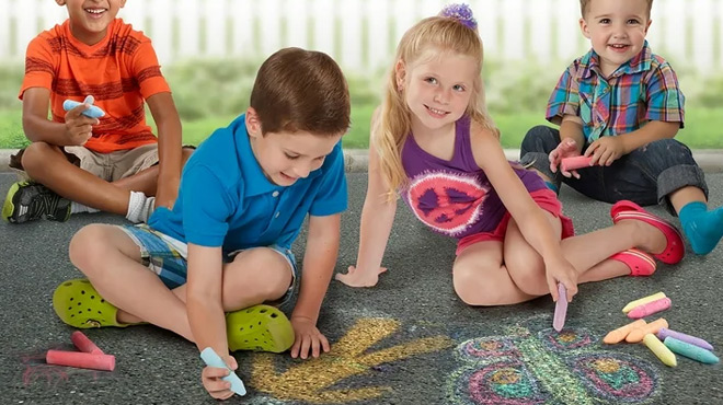 A Group of Kids Drawing Figures on the Street Using Cra Z Art Washable Sidewalk Chalk