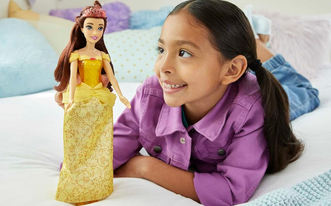 A Kid Holding Mattel Disney Princess Belle Fashion Doll