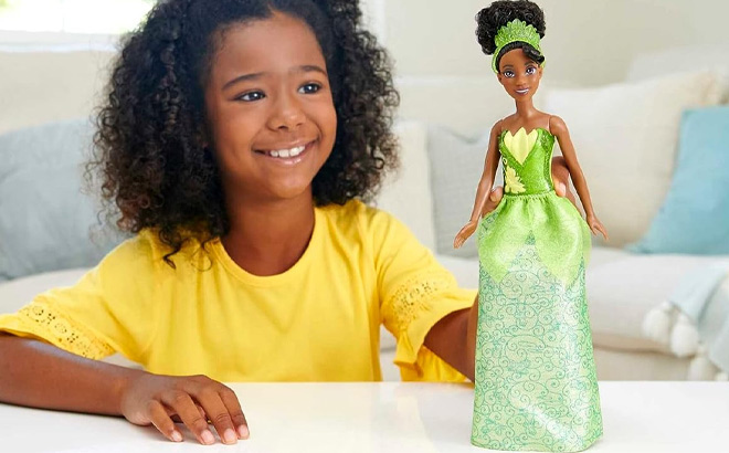 A Kid Holding Mattel Disney Princess Tiana Fashion Doll