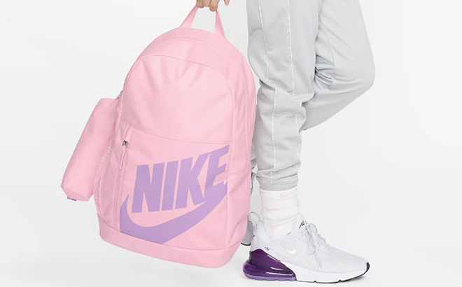 A Kid Holding Nike Elemental Kids Backpack in Pink Color