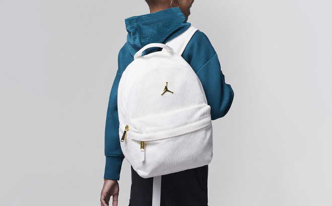 A Kid Wearing Jordan Mini Backpack