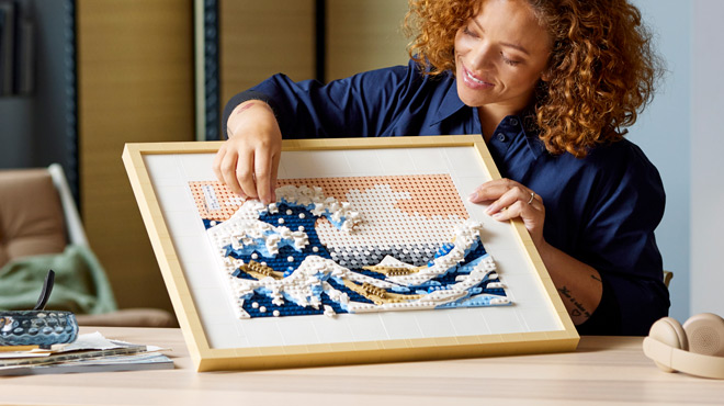 A Lady Building a LEGO Art Hokusai The Great Wave Art Piece
