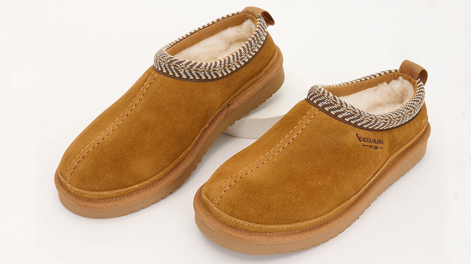 A Pair of Koolaburra by UGG Suede Slip Ons in Chestnut Colors
