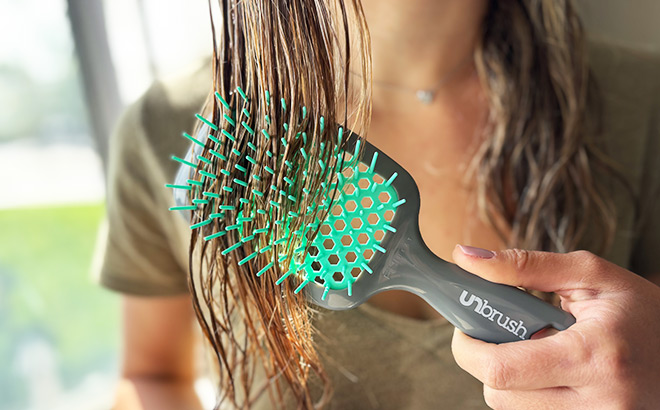 A Person Brushing Hair with UNbrush