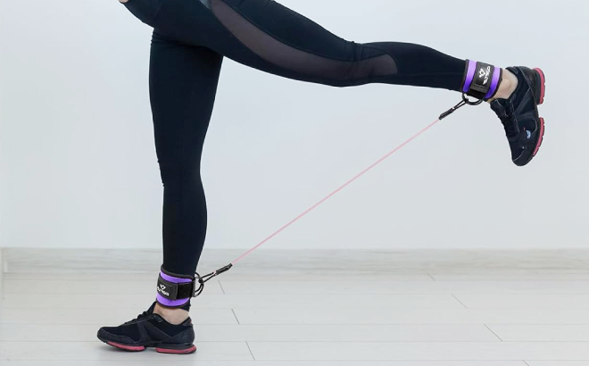 A Person Exercising Using Ankle Resistance Bands with Cuffs