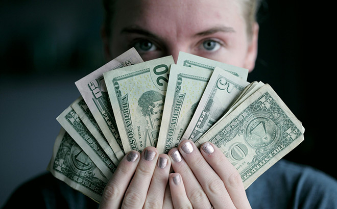 A Person Holding Cash