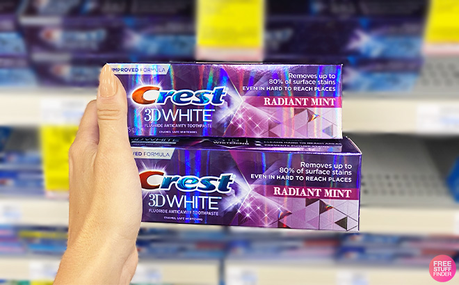 A Person Holding Crest 3D White Toothpastes