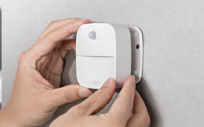 A Person Holding Eufy Lumi Stick On Night Light