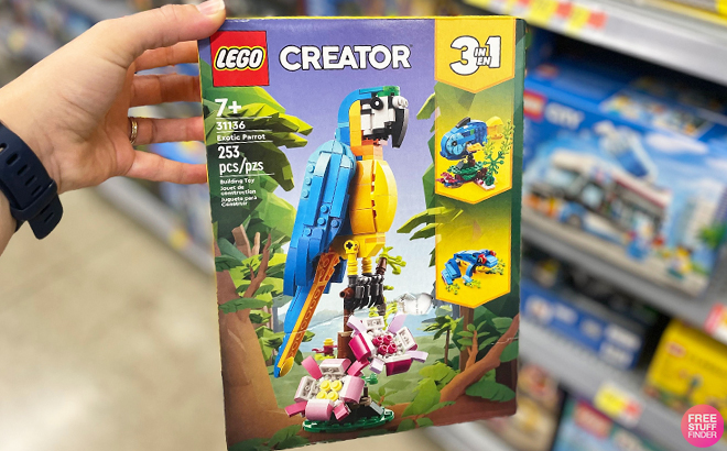 A Person Holding LEGO Creator Exotic Parrot 253 Piece Building Set