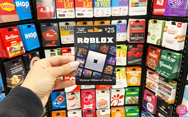 A Person Holding Roblox 25 Gift Card