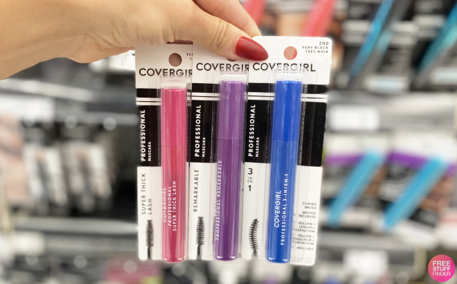 A Person Holding Three CoverGirl Professional Mascara at Walgreens Store