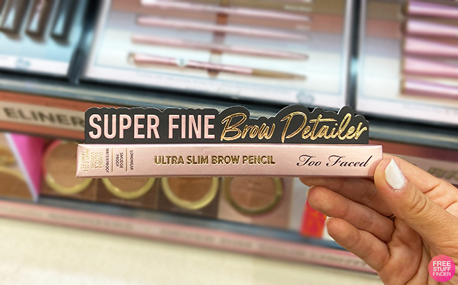 A Person Holding Too Faced Super Fine Brow Detailer Pencil A Person Holding Too Faced Super Fine Brow Detailer Pencil
