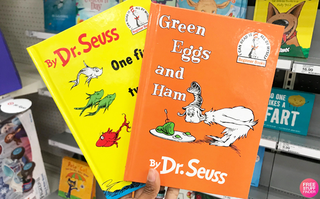 A Person Holding Two Dr Seuss Kids Books at Target