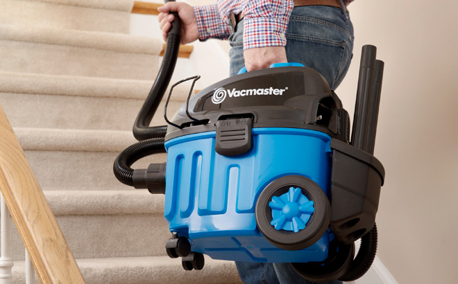 A Person Holding Vacmaster 4 Gallon 5 Peak HP Poly Household Vacuum