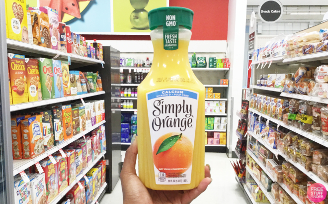 A Person Holding a Bottle of Simply Orange Juice