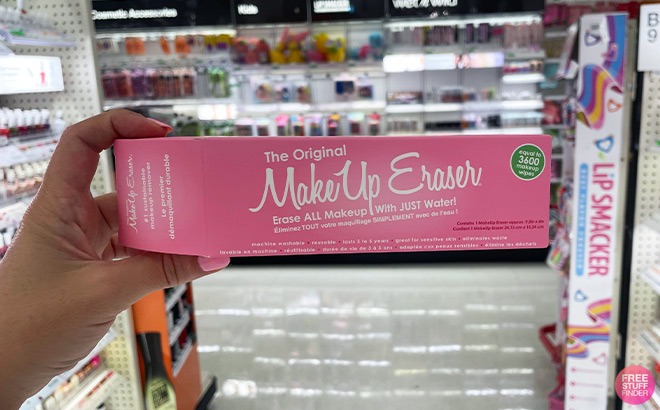 A Person Holding a Box of Makeup Eraser You Can Score For Free wth TCB inside a Store