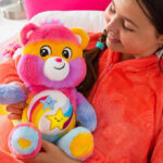 A Person Holding a Care Bears Dare to Tie Dye 14 Inch Plush