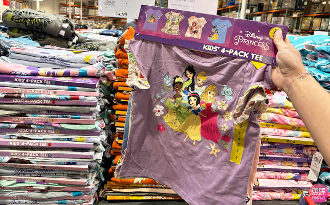 A Person Holding a Pack of 4 Disney Character Kids Character Tees 4